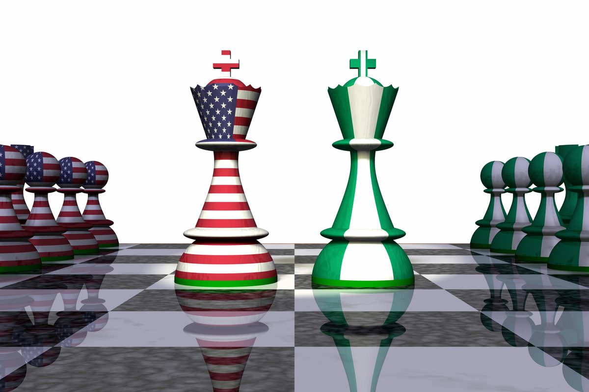 Chess kings in Nigerian and American flag colors facing each other on a chessboard
